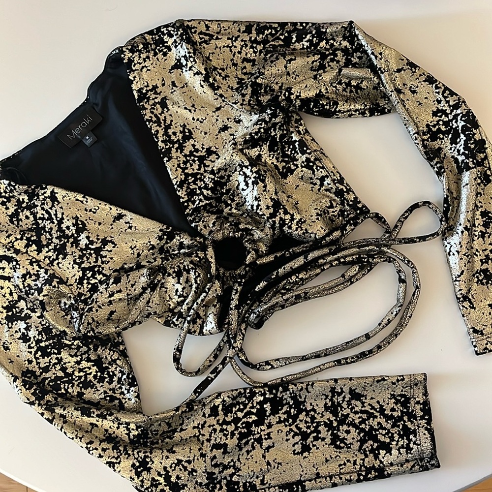 Long sleeve gold and black shirt. Never worn